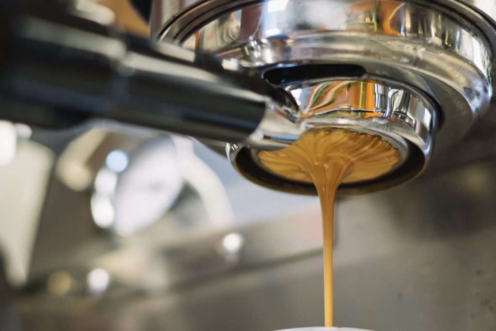 espresso machine makes coffee