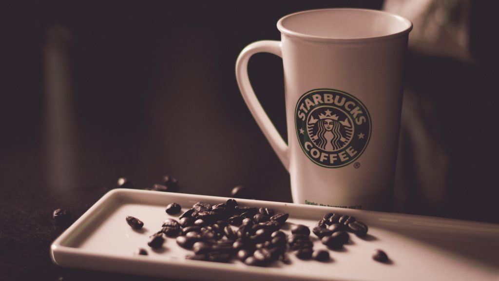 Starbucks coffee mug and beans